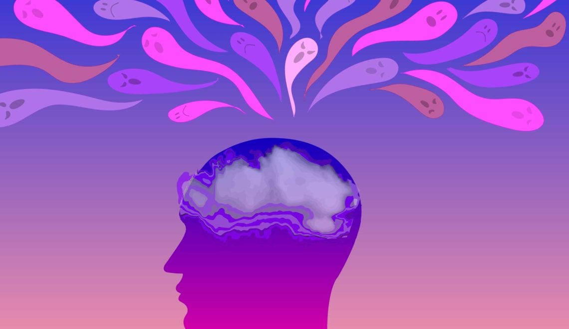 Cartoon conveys the feeling of anxiety. There is the outline of a human head with a foggy cloud over the brain. There are spooky ghosts flying around the head