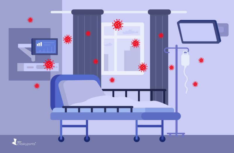 Cartoon image shows an empty hospital bed surrounded by red COVID particles