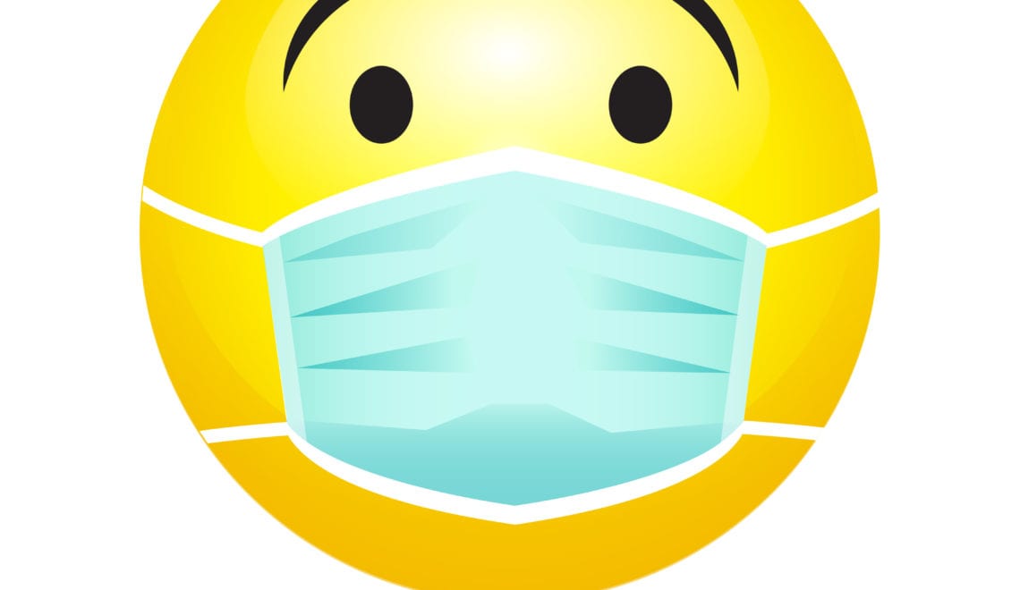 An image of mile emoji wearing a protective surgical mask in response to the coronavirus outbreak. Infected patient wears medical face mask to prevent spread of illness.