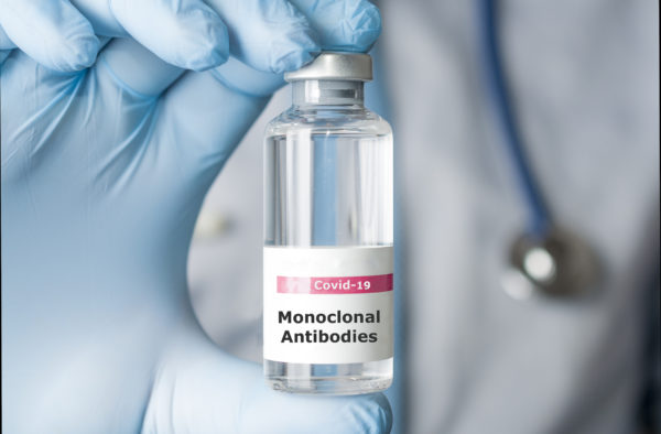 A photo of a doctor holding a vial of monoclonal antibodies, a new treatment for coronavirus Covid-19.