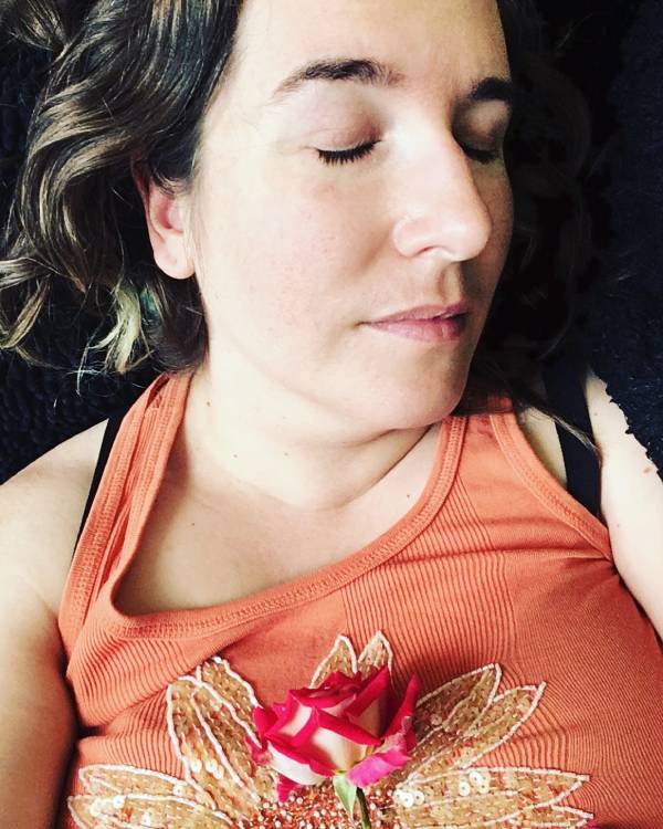 A photo of Angie Ebba, a woman with ankylosing spondyloarthritis, resting and recovering from her chronic illness.