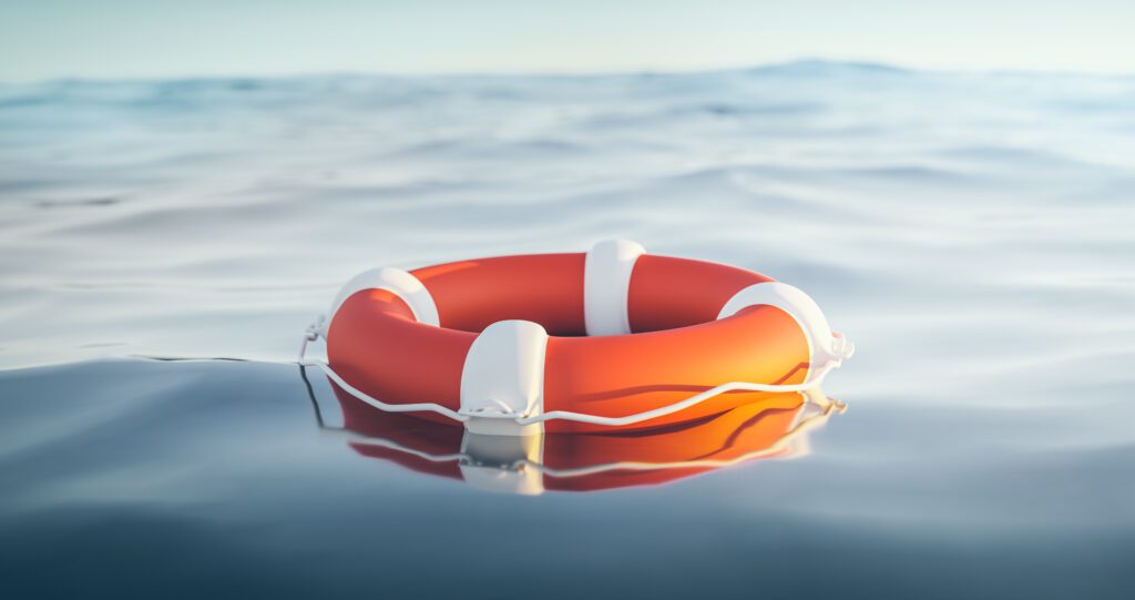 Photograph of a life preserver floating on a body of water