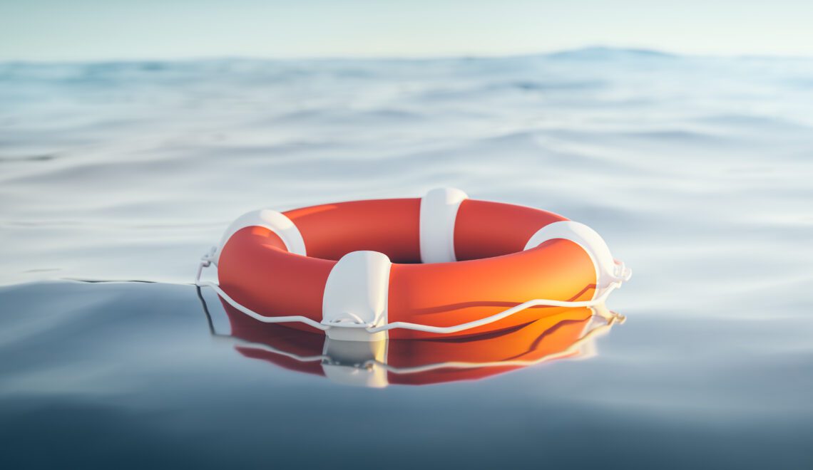 Photograph of a life preserver floating on a body of water