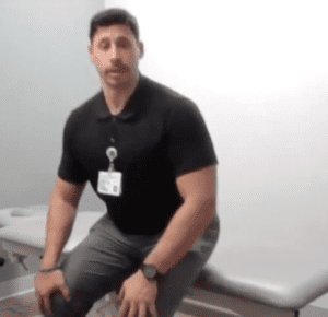 Hospital for Special Surgery (HSS) physical therapist Zack Rogers, PT, doing sit-to-standing exercise