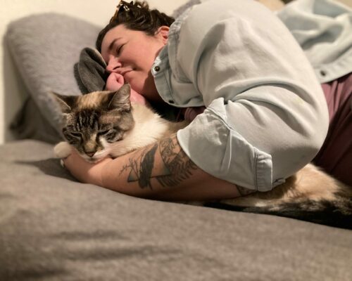 Angie Ebba in bed with cat